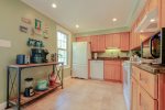 The kitchen is sized generously and is an inviting space for the family chef.